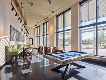 Game room with pool and shuffleboard tables